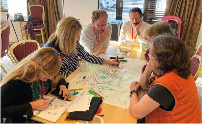 Community Engagement Day Looking at Plans Group of People