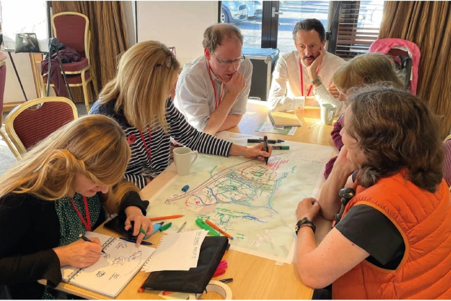 Community Engagement Day Looking at Plans Group of People