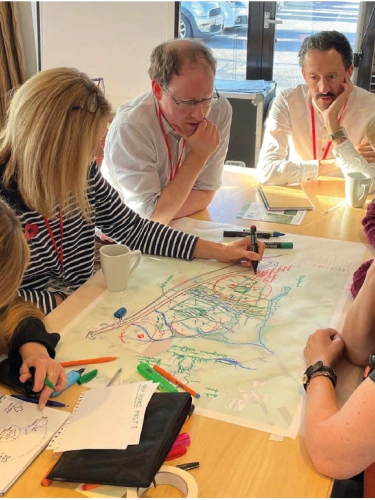 Community Engagement Day Looking at Plans Group of People